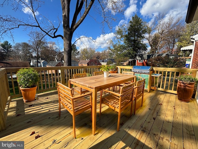 wooden deck featuring grilling area