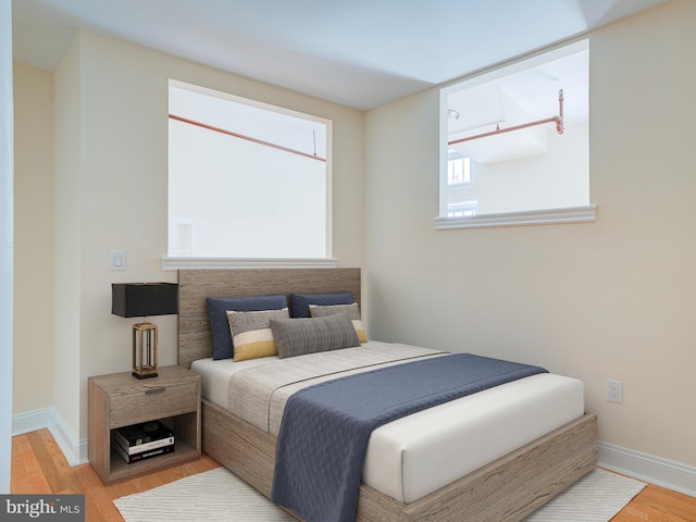 bedroom with light wood-type flooring