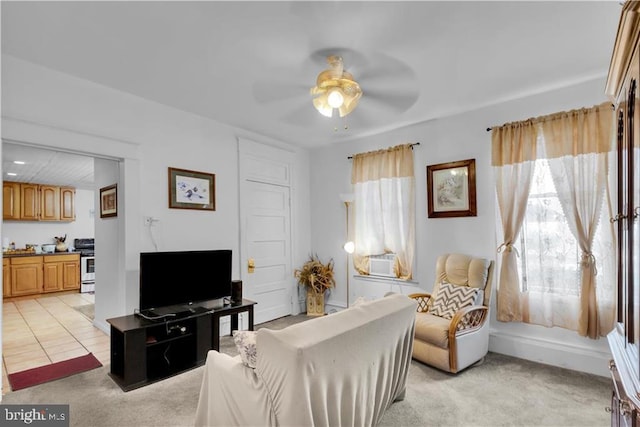 carpeted living room with ceiling fan and cooling unit