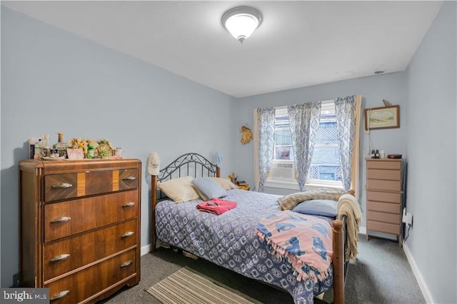 bedroom with dark colored carpet