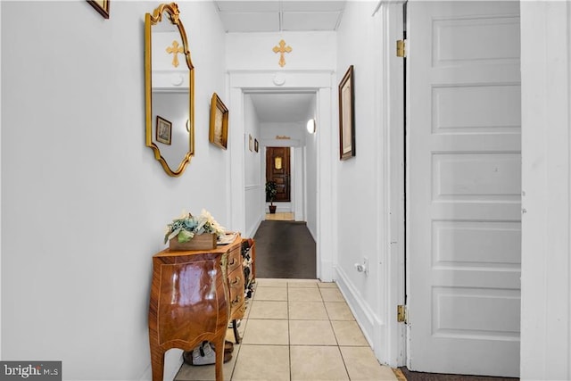 hallway with light tile patterned floors