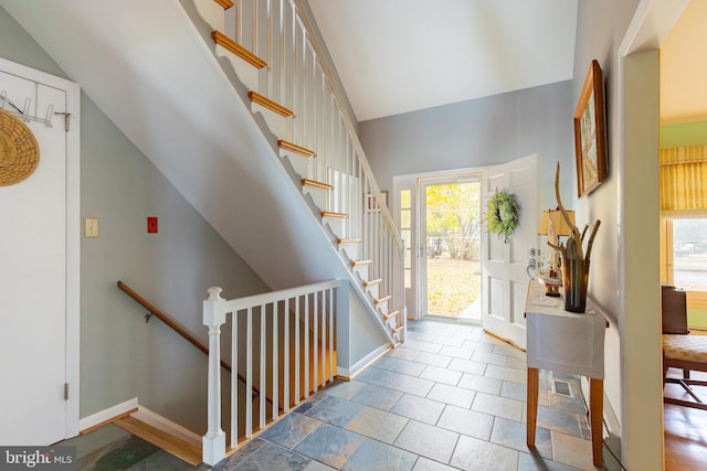 entrance foyer with a healthy amount of sunlight and lofted ceiling