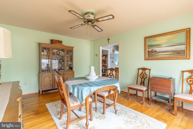 dining room featuring ceiling fan and light hardwood / wood-style flooring