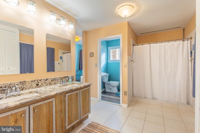 bathroom with vanity and tile patterned floors