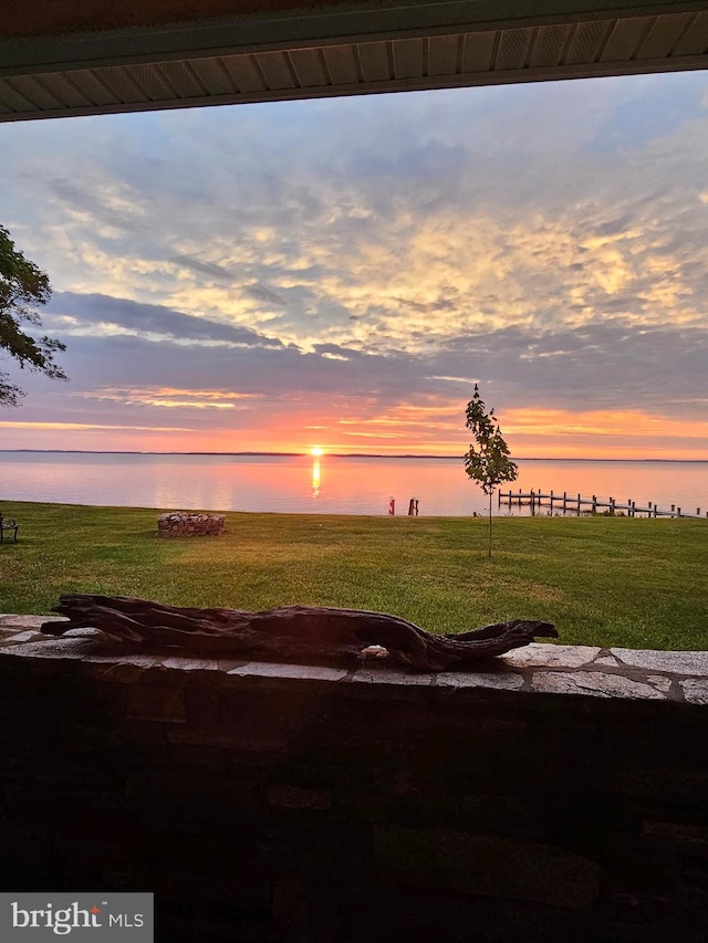 yard at dusk with a water view