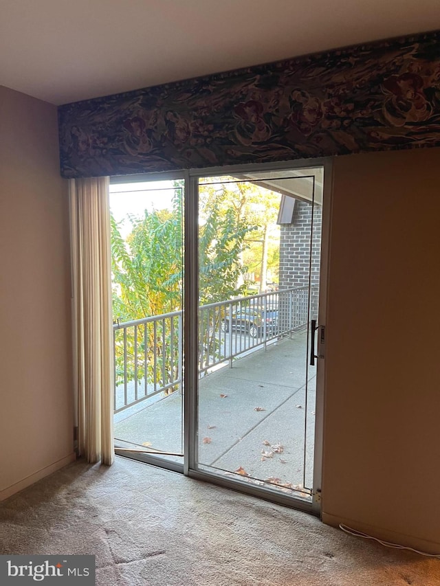 entryway with carpet floors