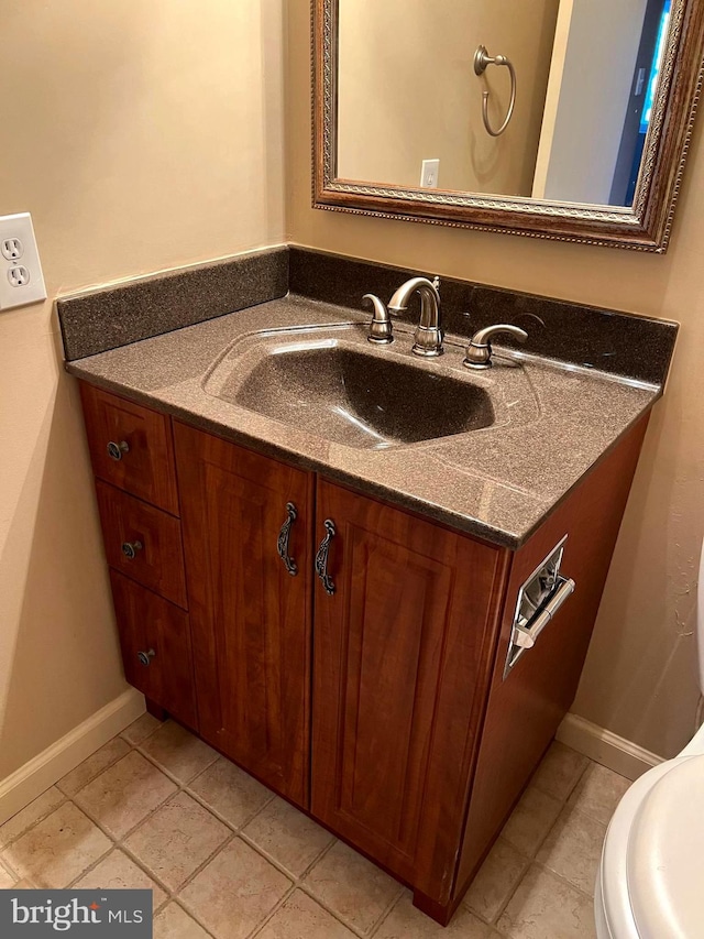 bathroom with tile patterned flooring and vanity