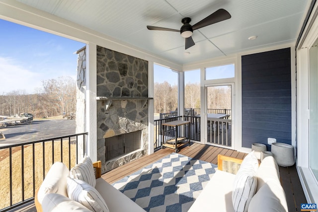 sunroom / solarium with ceiling fan