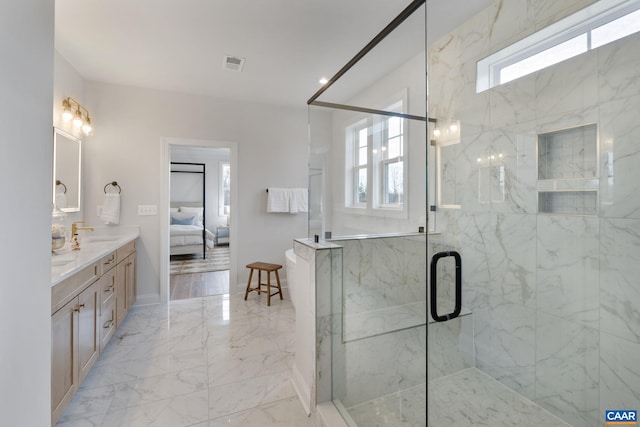 bathroom featuring vanity and a shower with shower door