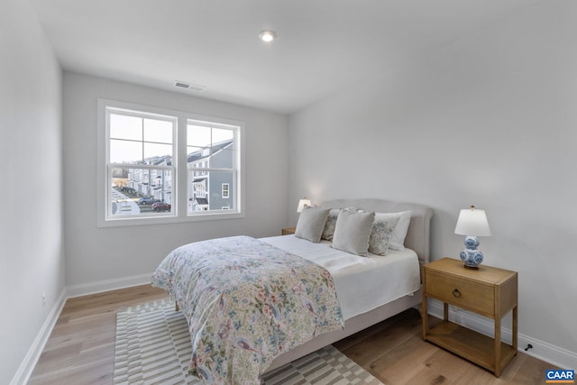 bedroom with light hardwood / wood-style floors