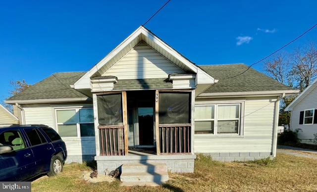 view of front of house featuring a sunroom