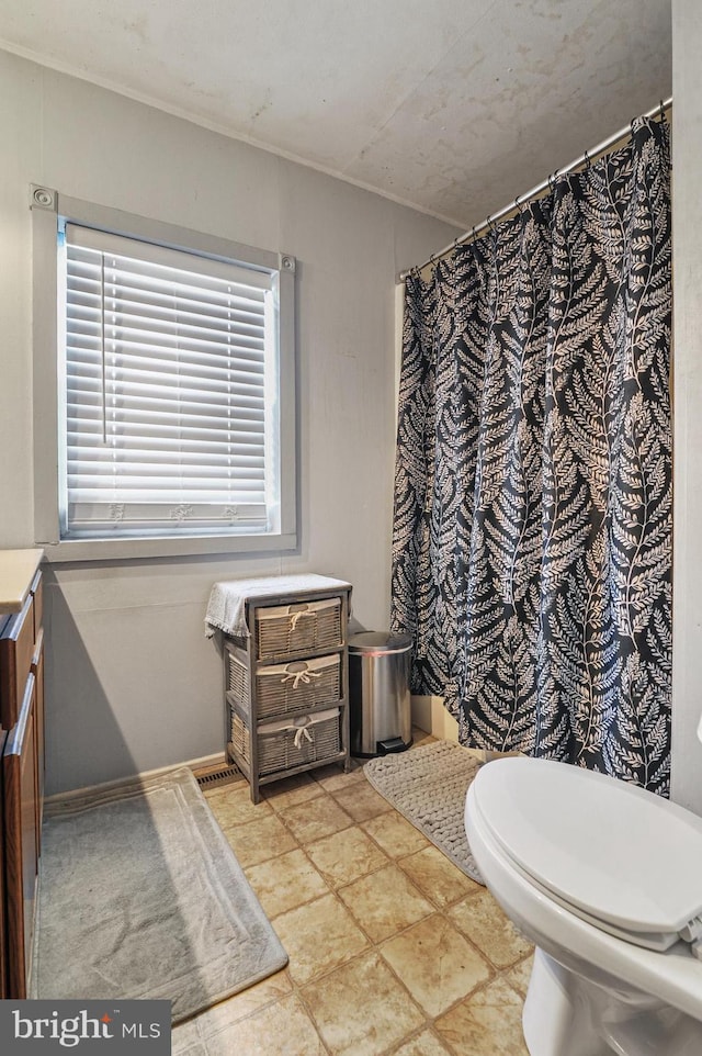 bathroom with vanity and toilet