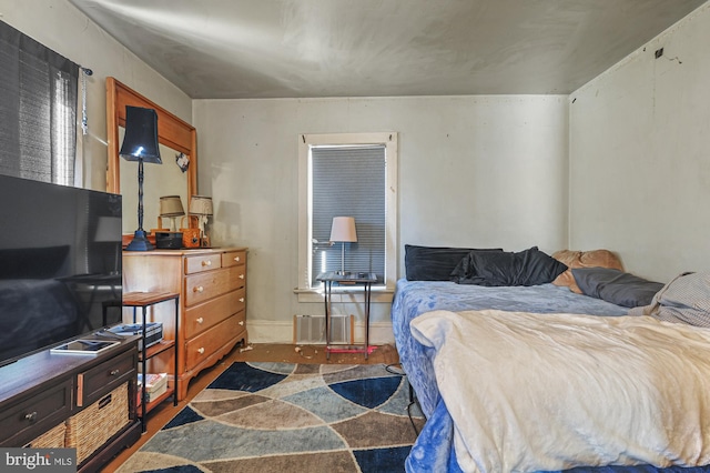 bedroom featuring dark wood-type flooring