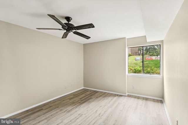 spare room featuring light hardwood / wood-style floors and ceiling fan