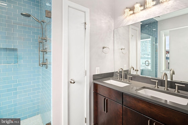 bathroom with an enclosed shower and vanity