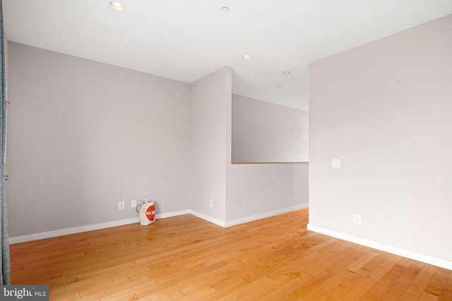 unfurnished room with light hardwood / wood-style floors