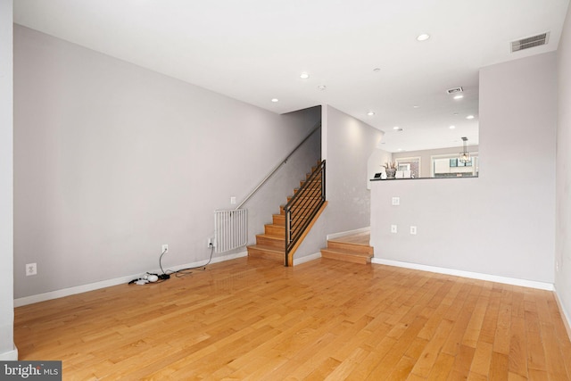 unfurnished living room featuring light wood-type flooring