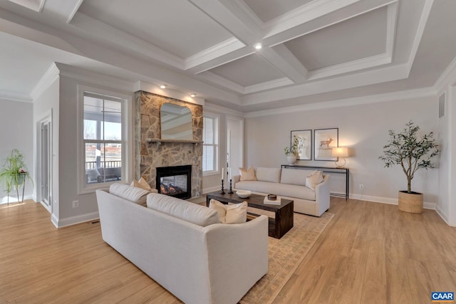 living room featuring plenty of natural light, light hardwood / wood-style flooring, and crown molding