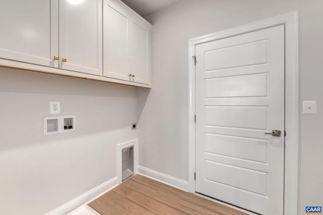 laundry area featuring light wood-type flooring, cabinets, washer hookup, and hookup for an electric dryer