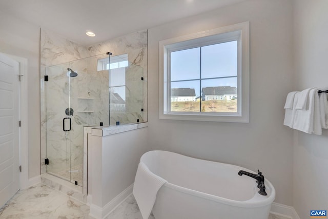 bathroom featuring separate shower and tub