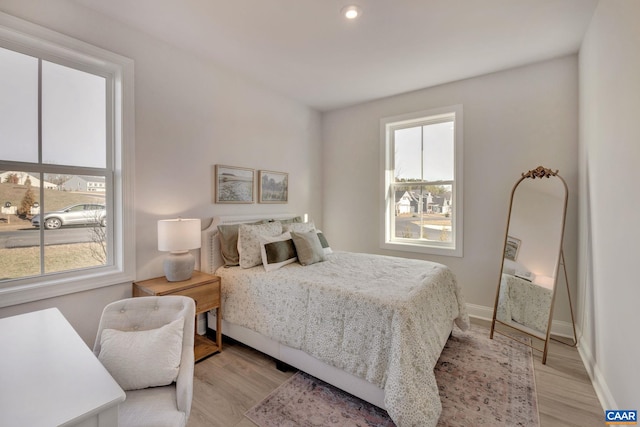 bedroom with light hardwood / wood-style flooring