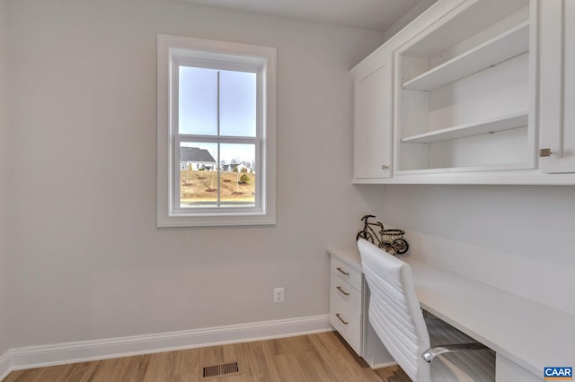 office area featuring a wealth of natural light and light hardwood / wood-style floors