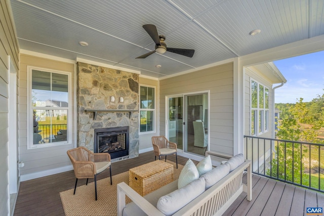 deck with ceiling fan and outdoor lounge area