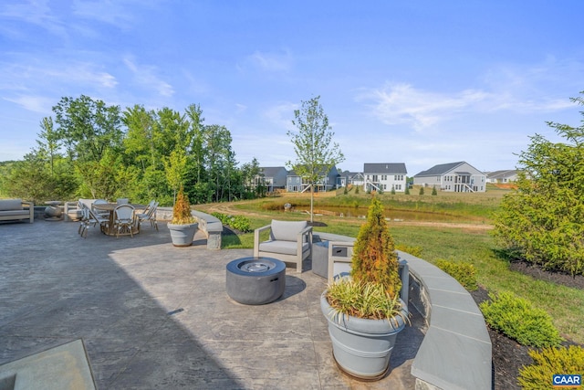 view of patio featuring an outdoor fire pit