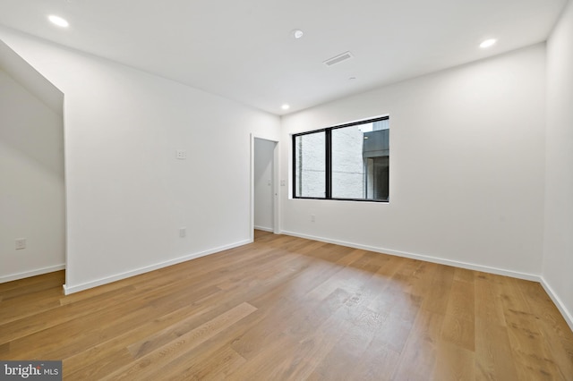 unfurnished room featuring light wood-type flooring