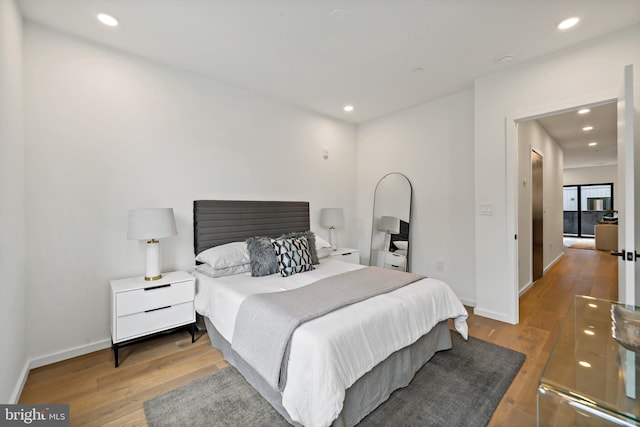 bedroom featuring light hardwood / wood-style floors