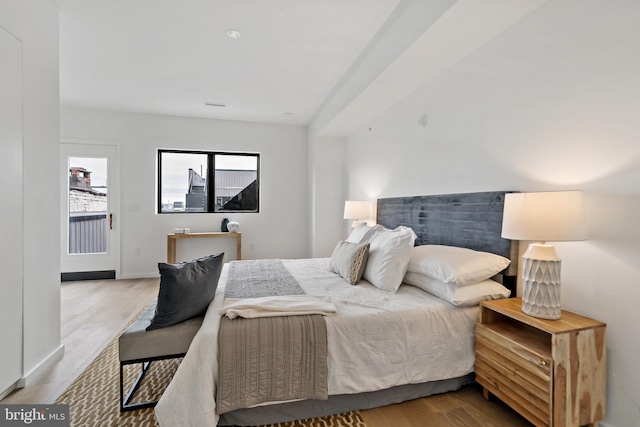 bedroom with light hardwood / wood-style floors