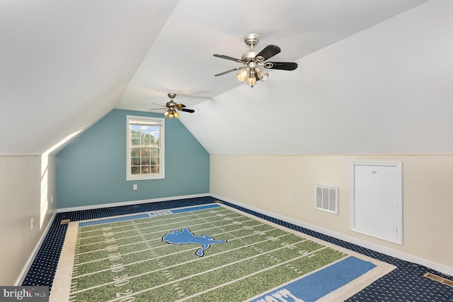 additional living space featuring carpet floors, vaulted ceiling, and ceiling fan