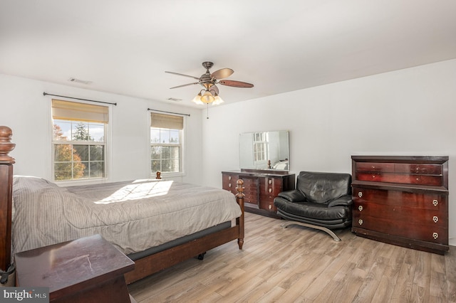 bedroom featuring light hardwood / wood-style flooring and ceiling fan