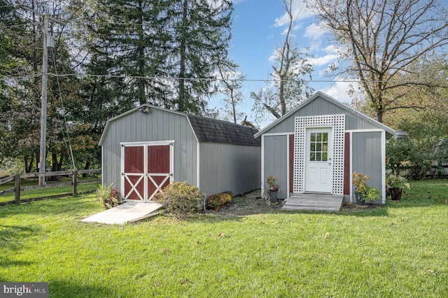 view of outbuilding featuring a lawn