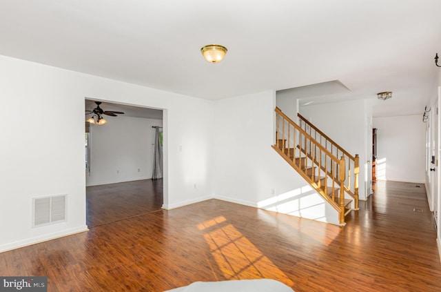 unfurnished room with dark hardwood / wood-style floors and ceiling fan