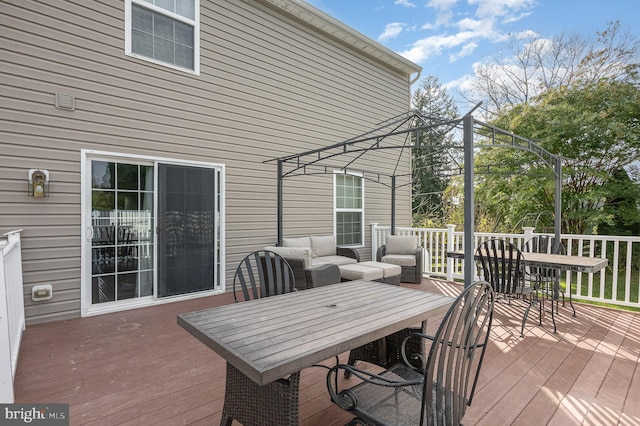 wooden deck featuring an outdoor living space