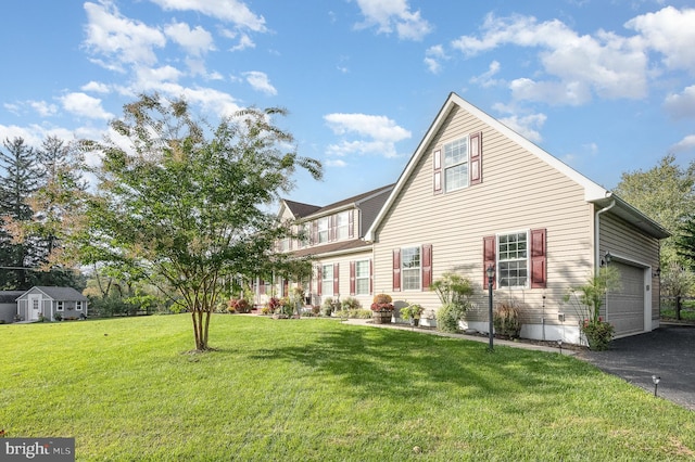 exterior space with a front yard and a garage