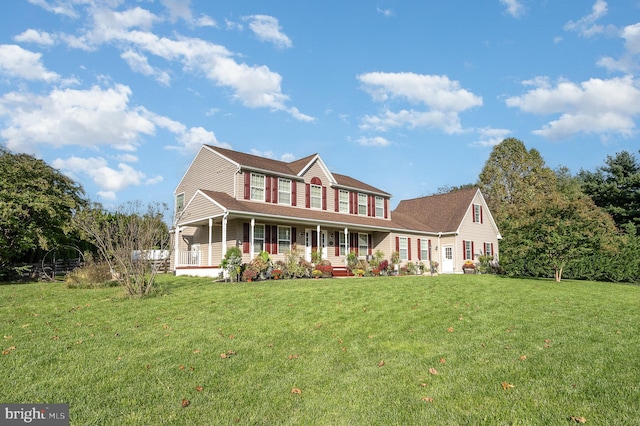 view of front of home featuring a front lawn and covered porch