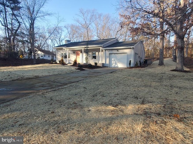 single story home with a front lawn and a garage