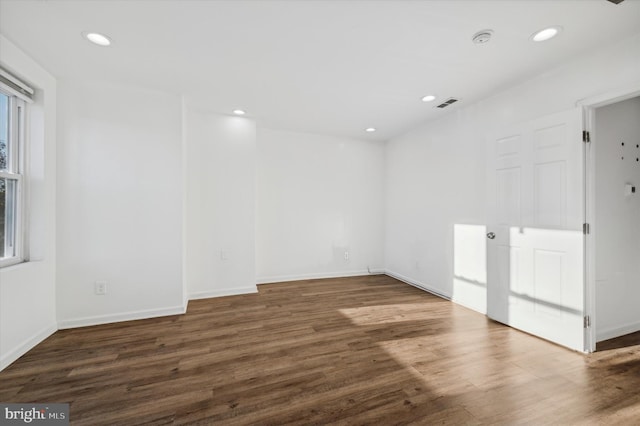 unfurnished room featuring dark hardwood / wood-style floors