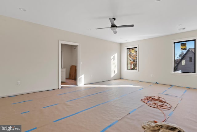 unfurnished room with ceiling fan