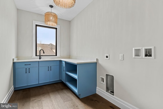 laundry room with cabinets, sink, dark hardwood / wood-style floors, and hookup for an electric dryer