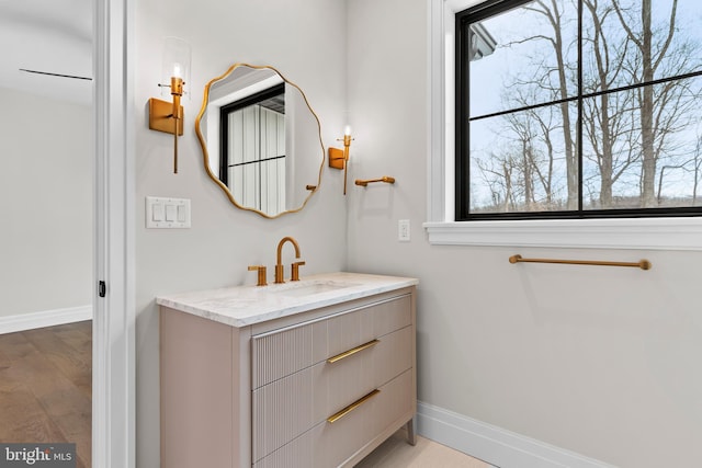 bathroom featuring hardwood / wood-style floors and vanity