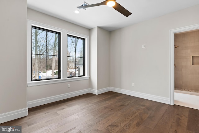 unfurnished room featuring ceiling fan and hardwood / wood-style floors