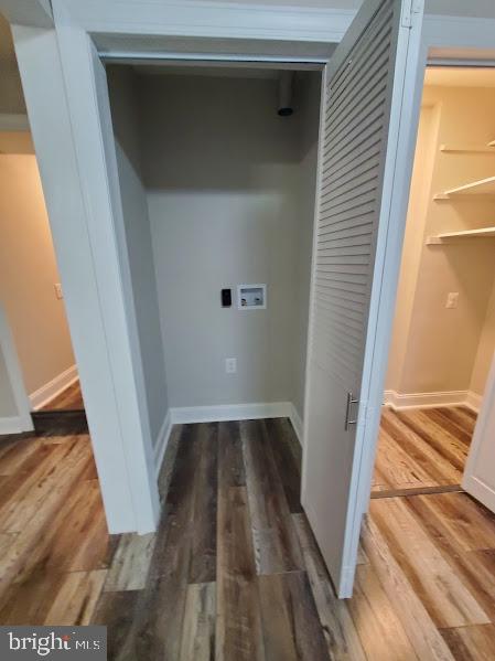 clothes washing area with washer hookup and dark hardwood / wood-style floors