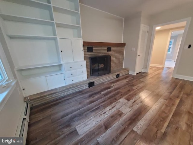 unfurnished living room featuring dark wood-type flooring