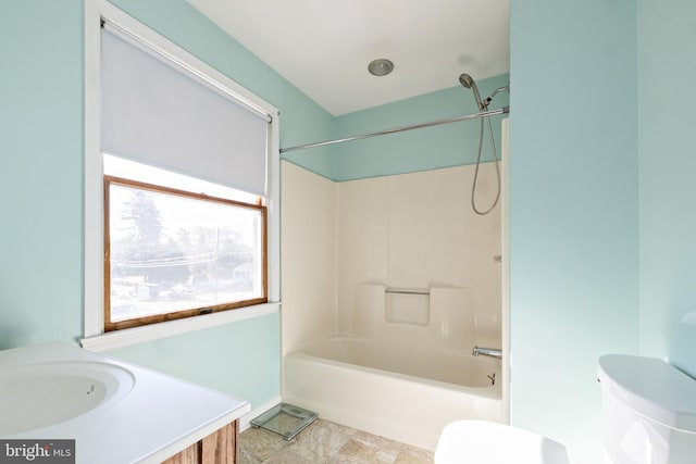 full bathroom featuring vanity, shower / bath combination, and toilet