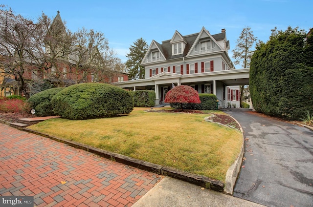 144 W Main St, Waynesboro, PA 17268 - view of front of property with a front lawn, a chimney, and asphalt driveway