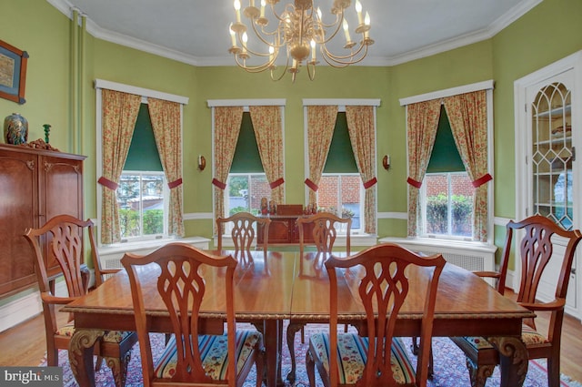 144 W Main St, Waynesboro, PA 17268 - dining room featuring light wood finished floors, a chandelier, and ornamental molding