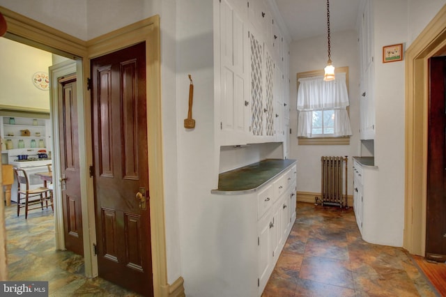 144 W Main St, Waynesboro, PA 17268 - hallway featuring radiator heating unit and stone finish floors